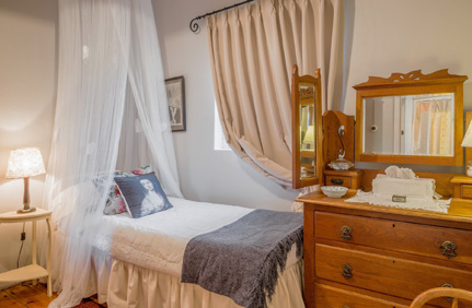Occupancy of Claremont Rose Cottage is up to 3 adults (double bed plus single bed in separate bedroom) plus a crib that can be placed next to the bed.